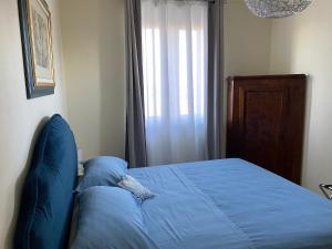 Postel nebo postele na pokoji v ubytování B&B Il Melograno