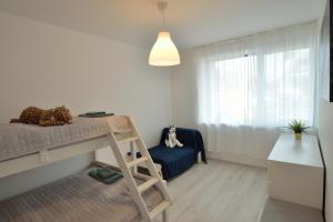 Postel nebo postele na pokoji v ubytování Sz36 Apartman