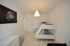 Postel nebo postele na pokoji v ubytování Sz36 Apartman