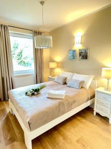 Posteľ alebo postele v izbe v ubytovaní Apartament Cobena