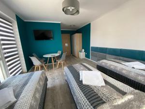 Postel nebo postele na pokoji v ubytování Tasarz Spa Ośrodek Wczasowy