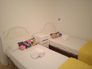 Ein Bett oder Betten in einem Zimmer der Unterkunft Apartamento Sissi