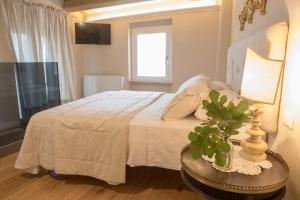 A bed or beds in a room at San Michele al Castello