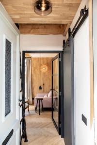 a hallway with a door leading to a living room at Gîte81 in Reeuwijk +19 photos