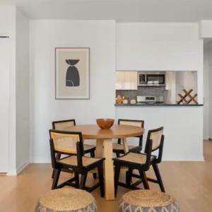 a dining room with a wooden table and chairs at Family Apartment in Excellent Sector of New York in New York