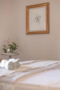 A bed or beds in a room at San Michele al Castello
