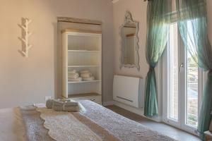 A bed or beds in a room at San Michele al Castello