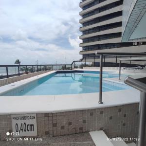 a swimming pool on the roof of a building at BEIRA MAR MEIRELES in Fortaleza