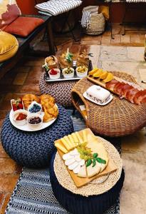 a table filled with plates of food and bread at Casa 39 Apartments in Rovinj