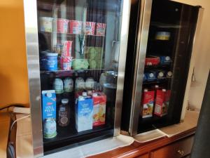 a refrigerator filled with lots of drinks at Austria Traveller Hotel Lenzing in Lenzing