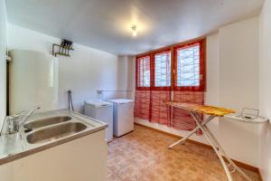 a kitchen with a sink and a counter top at La Grange de St Même in Saint-Même