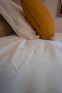 Postel nebo postele na pokoji v ubytování B&B l'Aigrin
