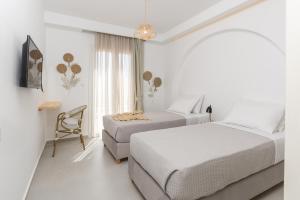 Ένα ή περισσότερα κρεβάτια σε δωμάτιο στο Naxos Skyline Deluxe Villas