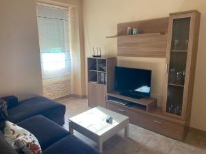 A television and/or entertainment centre at Casa A Illa de Arousa