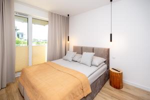 Un pat sau paturi într-o cameră la Apartament Jacuzzi & Sauna Chillout