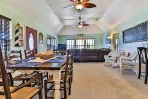 a dining room with a table and chairs at Escape From The Storm in Bolivar Peninsula