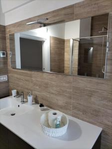 a bathroom with a sink and a mirror at Dimora Ketty in Noci +9 photos