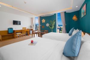 Voodi või voodid majutusasutuse Merry Land Hotel Da Nang toas