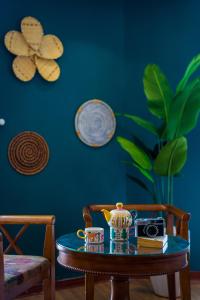 a table with a teapot and a tea pot on it at Merry Land Hotel Da Nang in Danang
