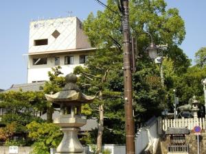 a street light next to a statue in front of a building at Seto Park Hotel - Vacation STAY 83745v in Seto +5 photos