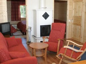Televisyen dan/atau pusat hiburan di Wanha Pappila Cottages