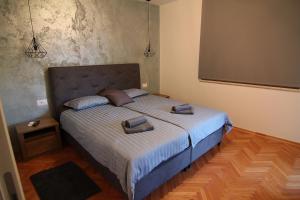 En eller flere senge i et værelse på Apartman Stella Veruda