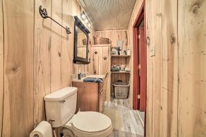 a bathroom with a toilet and a sink at Charming New Concord Cabin on 50-Acre Farm! in New Concord +24 photos