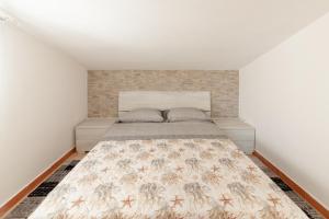 A bed or beds in a room at Tramontana