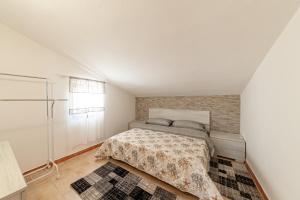 A bed or beds in a room at Tramontana