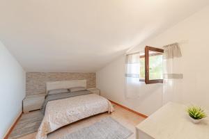 A bed or beds in a room at Tramontana