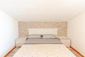 A bed or beds in a room at Tramontana