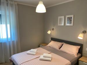 Posteľ alebo postele v izbe v ubytovaní M Plus Residence