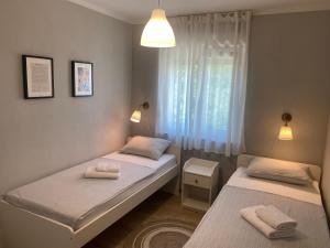 Posteľ alebo postele v izbe v ubytovaní M Plus Residence