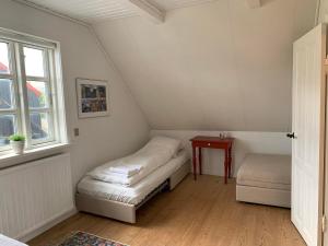 En eller flere senge i et værelse på Cosy house in the heart of Tórshavn (Á Reyni)