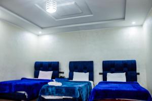 Voodi või voodid majutusasutuse HOTEL BORJ EL ARAB toas