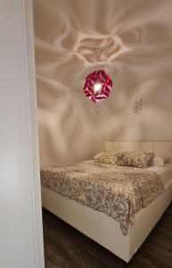 Кровать или кровати в номере Apartman Kokola