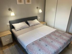 Posteľ alebo postele v izbe v ubytovaní M Plus Residence