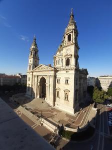 an old building with two towers on top of it at Basilika Monnalisa luxury 3 bedrooms apartment with amazing view NEED RESERVATION X FREE PARKING in Budapest