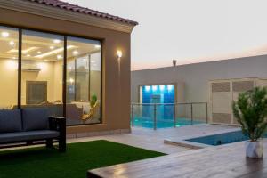 a view of a house with a swimming pool at forsana resort in Dammam