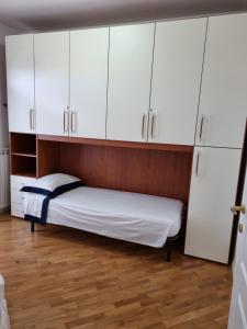 Postel nebo postele na pokoji v ubytování Casa a Vecchiano nei pressi Pisa, Lucca e Versilia