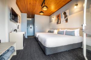 a hotel room with two beds and a sink at Nightcap at Federal Hotel Mt Gambier in Mount Gambier +108 photos