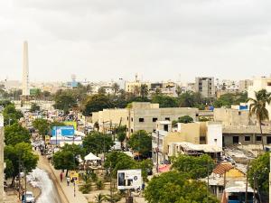 a view of a city with buildings and trees at Chez El Hadji et Hamidou in Dakar