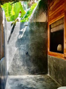 a stairway leading to a building with a window at Musa Bintang Villas and Bungalows Gili Air in Gili Air
