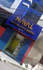 un edificio con un cartello sul lato di Hostal NAVAL a La Paz