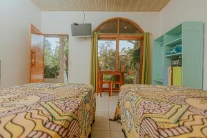 Postel nebo postele na pokoji v ubytování COCO Beach Village