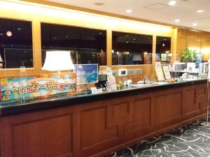 a bar in a restaurant with a counter top at Hotel Abest Naha Kokusai Street in Naha