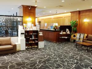 a lobby with a store with couches and a pharmacy at Hotel Abest Naha Kokusai Street in Naha