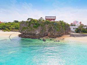 an island in the ocean with a building on it at Hotel Abest Naha Kokusaidori in Naha