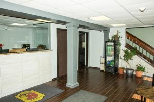 a lobby of a restaurant with a counter at Super 8 by Wyndham Michigan City in Michigan City