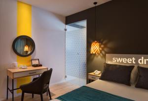 Postel nebo postele na pokoji v ubytování Prima City Hotel